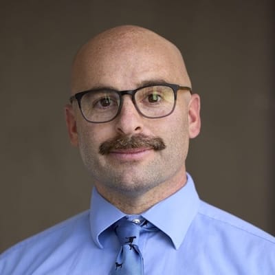 A headshot of David Huber.
