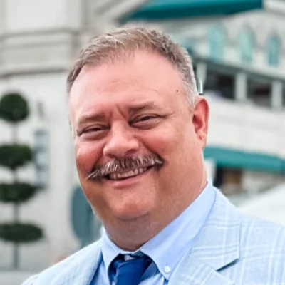 A headshot of John Pitcock.