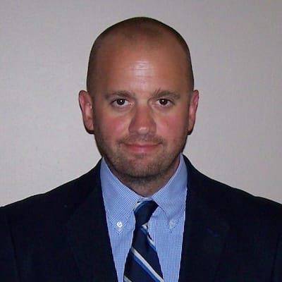 A headshot of Ryan Okey.